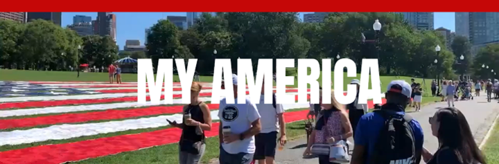 2026-02-23-MY-AMERICA-Flag-Kits-Graphic Image of a park full of people with a large American Flag image on the grass and the words "My America."
